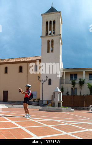 Italy, Sardinia, San Teodoro, a tourist in the village main square Stock Photo