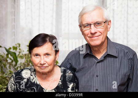 Portrait of smiling senior man and woman. Stock Photo
