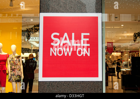 sale signs in shop window Stock Photo