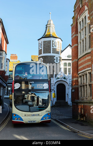 Coastlinx Bus coming through the narrow Bridge street in Lyme Regis, Dorset England Stock Photo