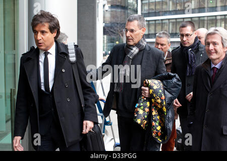London, UK. 8th February 2013. Phone Hacking Payouts, Rolls Building, High Court, London, UK Picture shows Uri Geller (center holding colourful jacket) next to (left) David Sherborne QC arriving at the High Court, Rolls Building where News International has agreed to settle 130 civil damages claims for News of the World phone hacking with individuals. Credit:  Jeff Gilbert / Alamy Live News Stock Photo