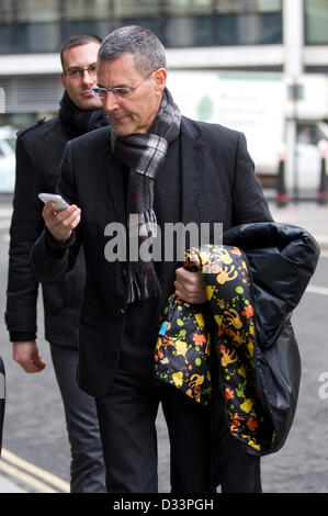London, UK. 8th February 2013. Phone Hacking Payouts, Rolls Building, High Court, London, UK Picture shows Uri Geller (center on telephone) arriving at the High Court, Rolls Building where News International has agreed to settle 130 civil damages claims for News of the World phone hacking with individuals. Credit:  Jeff Gilbert / Alamy Live News Stock Photo