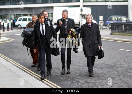 London, UK. 8th February 2013. Phone Hacking Payouts, Rolls Building, High Court, London, UK Picture shows Uri Geller (center on telephone) next to (left) David Sherborne QC arriving at the High Court, Rolls Building where News International has agreed to settle 130 civil damages claims for News of the World phone hacking with individuals. Credit:  Jeff Gilbert / Alamy Live News Stock Photo