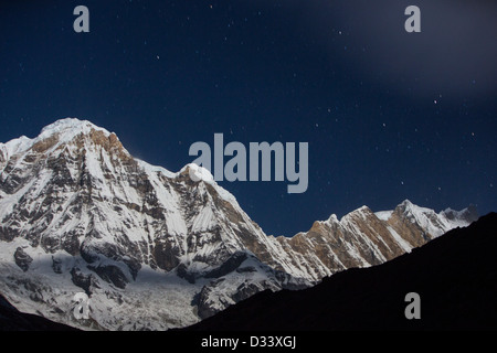 The night sky over Annapurna South and Annapurna Fang in the Annapurna Sanctuary, Himalayas, Nepal. Stock Photo