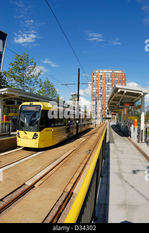 Metro tram at the Salford Quays terminus of Manchester Metrolink next ...