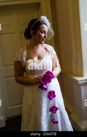 A model dressed as bride wearing wedding dresses at a Bridal Fayre, Nanteos Mansion, Aberystwyth Wales UK Stock Photo