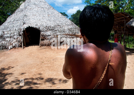A Yagua people man showing how to use a blowgun (blowpipe), surroundings of Ituitos, Amazonian Peru Stock Photo