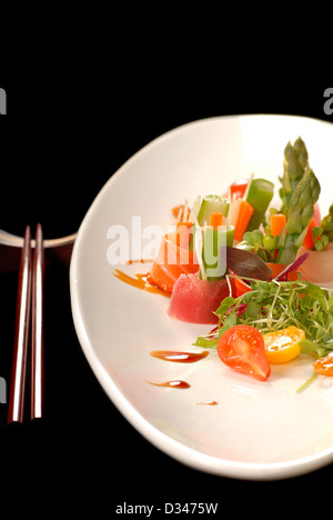 Fresh raw japanese sashimi with brown chop sticks Stock Photo