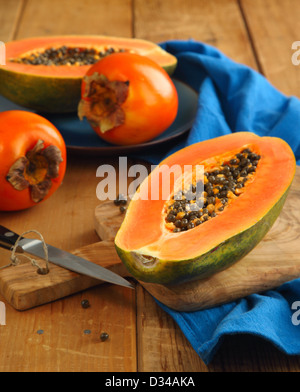 Papaya and persimmon Stock Photo