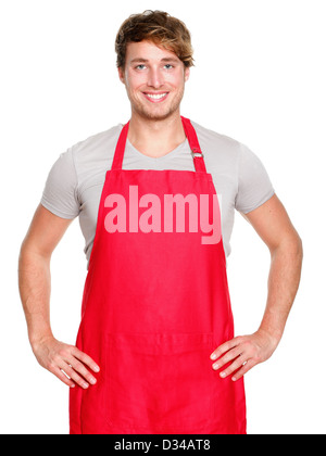 Portrait of smiling young Caucasian male entrepreneur or shop assistant in red apron isolated on white background Stock Photo