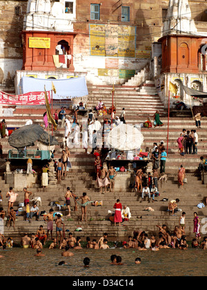 Indian Hindus on ghats at Varanasi, India, during morning puja. Stock Photo