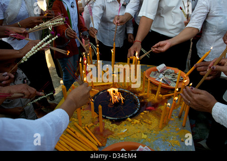 Cambodians mourn the loss of King Norodom Sihanouk, by lighting candles in his honor. Phnom Penh, Cambodia. © Kraig Lieb Stock Photo