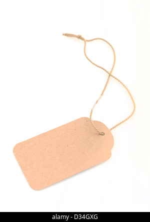 Blank recycled gift tag tied with string to write own message Stock Photo