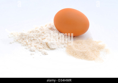 raw ingredients for baking which consists of an egg, flour and sugar Stock Photo