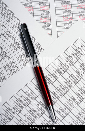 Business analysis spreadsheets showing sales results with pen Stock Photo