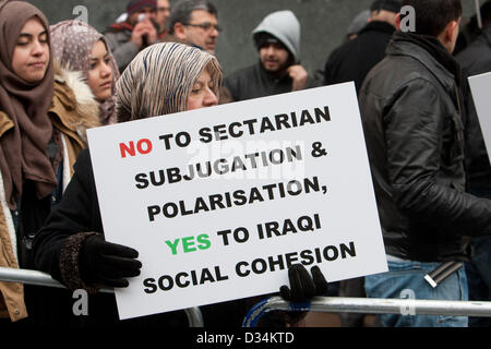 London, UK. 9th February 2013. Iraqi woman holds placard reading 'No to sectarian & polarisation, yes to Iraqi social cohesion' as Iraqis protest in solidarity with their countrymen in Iraq, who they perceive to being subjected to injustices by the current Iraqi regime. Iraqi Embassy, London, UK, 09 February 2013. Credit:  martyn wheatley / Alamy Live News Stock Photo