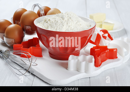 Ingredients for baking: eggs, butter, flour and cookie cutters Stock Photo