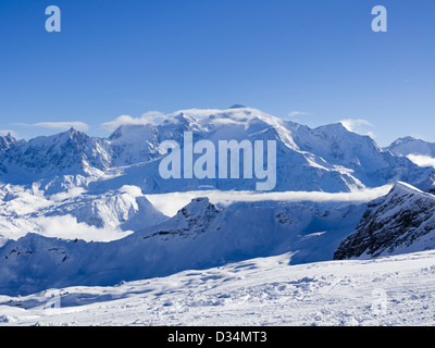 Snowcapped Mont Blanc and mountains distant view from Les Grandes Platieres in Le Grand Massif in French Alps in winter. France Stock Photo