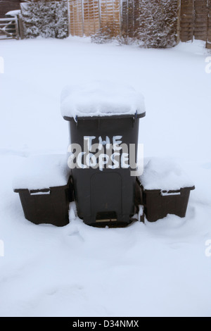 Waste and Recycling Bins out in the Snow Stock Photo