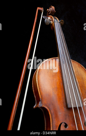 fiddle neck and bow on black background close up Stock Photo