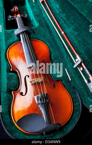 violin with bow in green velvet box close up Stock Photo