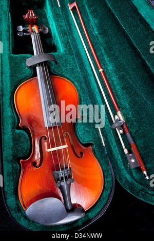 violin with bow in green velvet case close up Stock Photo