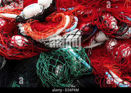Colorful commercial fishing nets stacked on shore in Sitka, Alaska , USA Stock Photo
