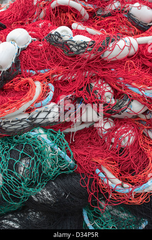 Colorful commercial fishing nets stacked on shore in Sitka, Alaska , USA Stock Photo