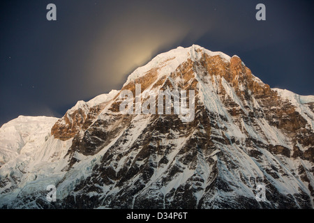 The night sky over Annapurna South and Annapurna Fang in the Annapurna Sanctuary, Himalayas, Nepal, Stock Photo