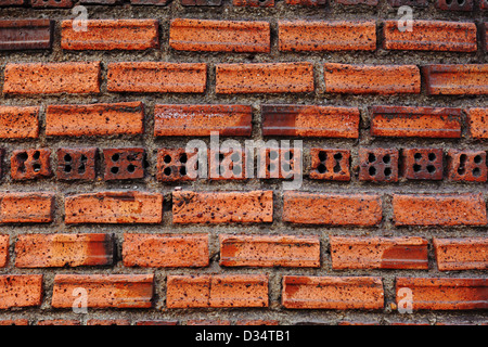 The old red vintage grunge dark brick wall background Stock Photo