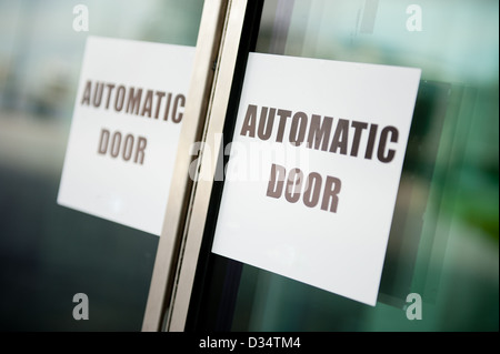 Sign on automatic door. Stock Photo