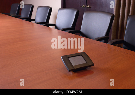 Empty Conference Room With Phone In Middle Of Table Stock Photo