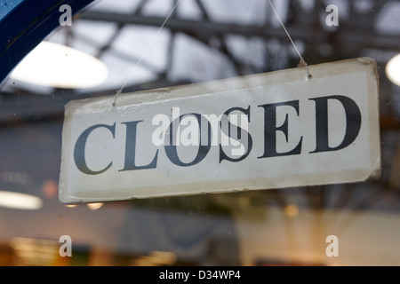 closed sign in the door window of a shop in east side vancouver Stock Photo
