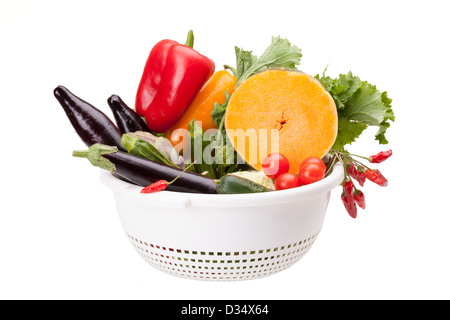 Colander With Vegetables On White Stock Photo