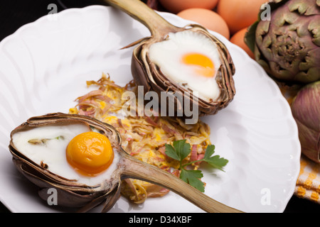 Eggs In Artichokes Stock Photo