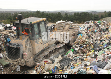 Bulldozer on landfill site, Dorset UK Febuary Stock Photo