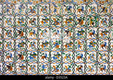 Historic tiled wall with many mythical creatures: satyrs, centaurs, unicorns in Real Alcazar, Seville, Spain, Andalusia region. Stock Photo
