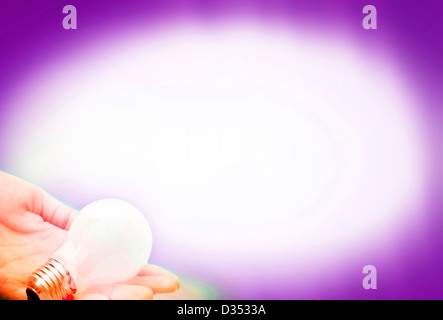 Background with lit lightbulb. Isolated on pink. Stock Photo