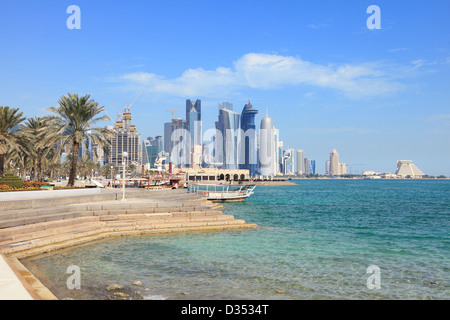 People stroll among the flowerbeds of Doha Corniche in January 2013, Stock Photo