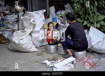 Thailand Poverty. Child Eating Food Among The Garbage Collection In A ...