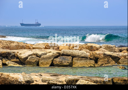 Cargo ships in the sea on horizon Stock Photo