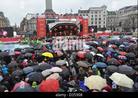 Trafalgar Square, London, UK. 10th February 2013. The stage in Trafalgar Square for Chinese New Year with a sea of umbrellas. The Chinese New Year, 'The Year of the Snake' is celebrated in London. The largest Chinese New Year celebrations outside of Asia takes place in Trafalgar Square and China Town with over half a million visitors expected. Credit Matthew Chattle/Alamy Live News Stock Photo