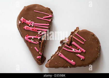 broken heart Valentine chocolate heart cake, heart shaped cake isolated on white background - broken hearted concept on Valentine Day, Valentines Day Stock Photo