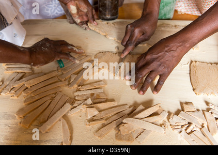 Barsalogho, Burkina Faso, May 2012: Making bisuits from boabab fruit pulp for sale. Stock Photo