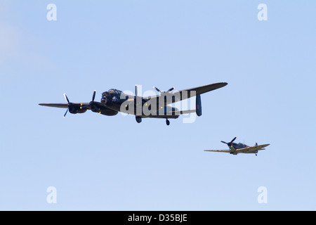 RAF Avro Lancaster Bomber and spitfire in flight Stock Photo