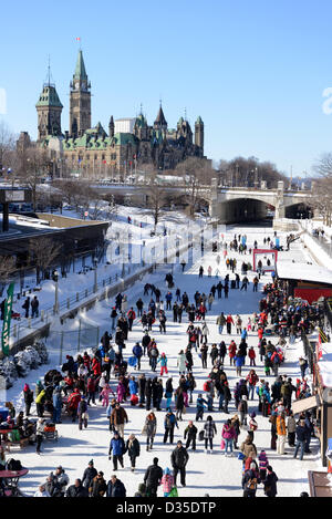 People celebrate the Winterlude festival in Canada’s capital on the frozen Rideau Canal, the world’s largest outdoor skating rink.  February 9, 2013 in Ottawa Ontario. Stock Photo