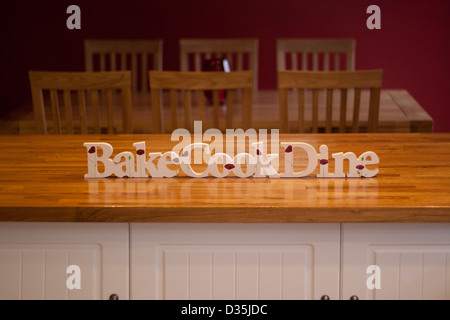 Bake, cook and dine signs in the kitchen Stock Photo