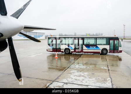 A passenger bus on the apron of an airport. Stock Photo