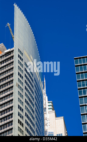 Modern skyscraper architecture; the tops of contemporary buildings with blue sky Stock Photo