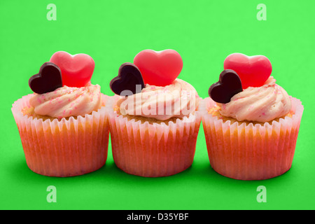 Three valentines cupcakes in a row Stock Photo